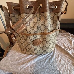 Authentic Vintage Gucci GG Plus Monogram Drawstring Bucket Bag – Brown
